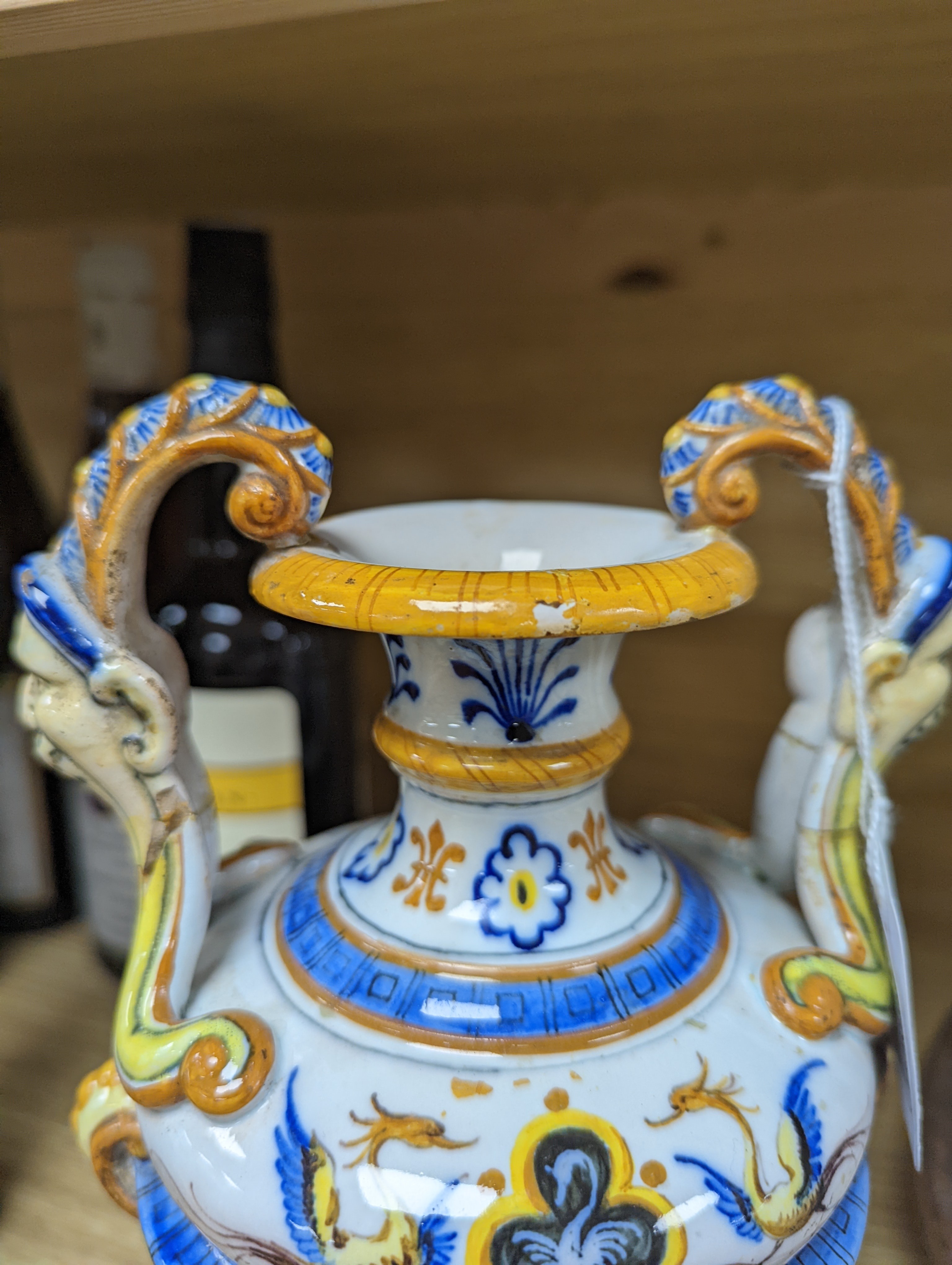 A Ginori maiolica two handled vase and Delft polychrome double cylinder teapot 27cm